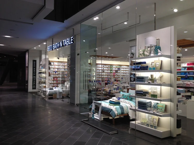 Retail entrance with full-height glass panels and doors