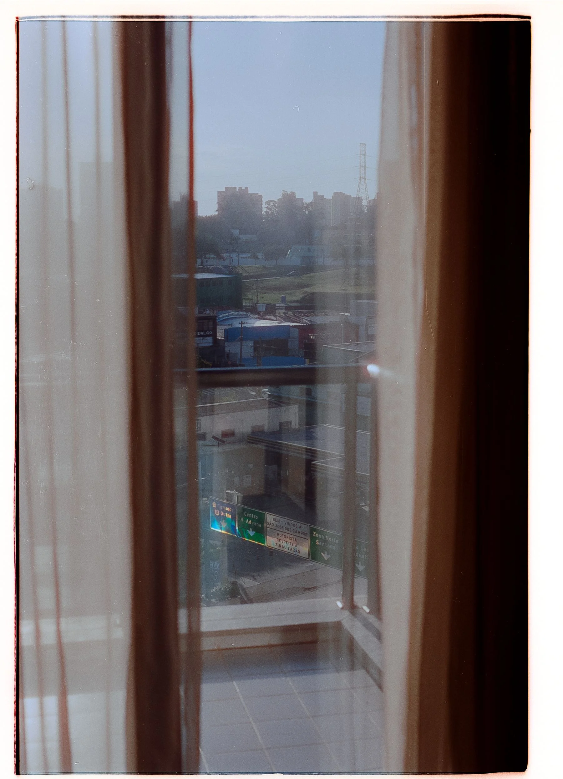 City buildings seen through a closed window
